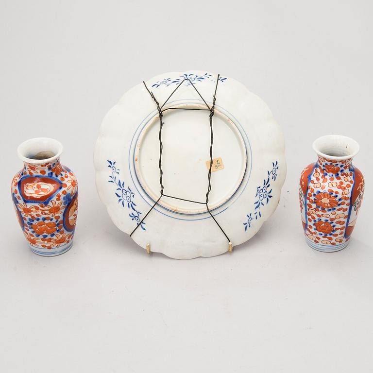 A dish and two vases in porcelain, Japan, end of the 19th Century.