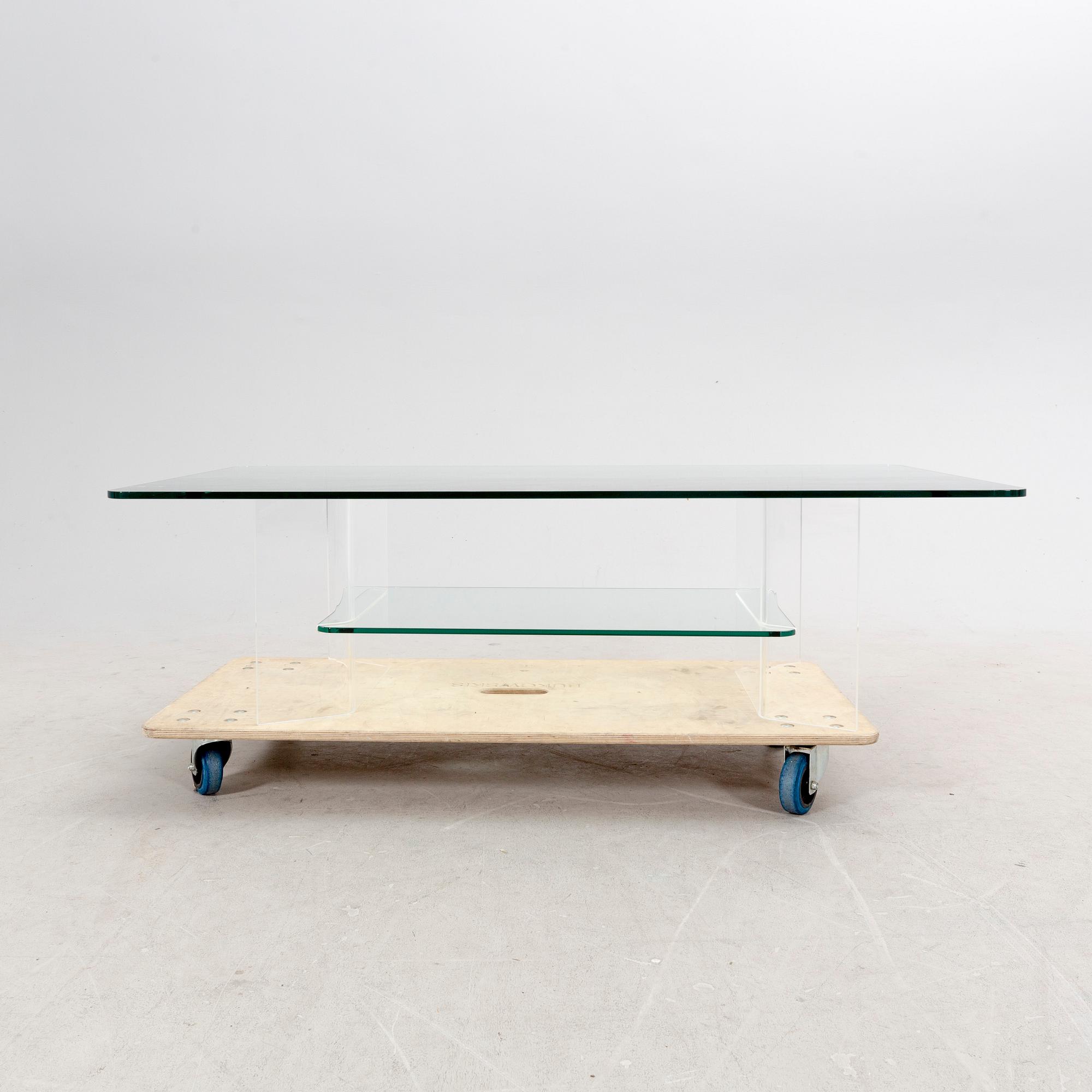 A late 20th century glass and plexi coffee table.
