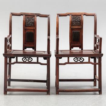 A pair of Chinese hardwood armchairs, early 20th century.