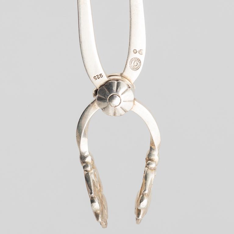 Sugar box, silver 830, Swedish import mark, and sugar tongs, sterling silver, Georg Jensen, Denmark.