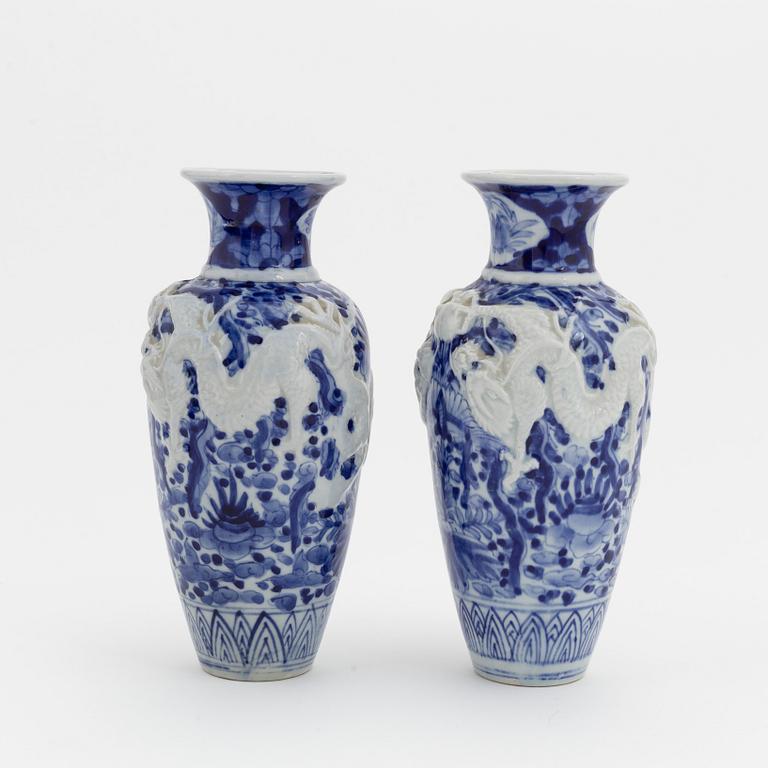 A pair of Japanese blue and whte vases, around 1900.