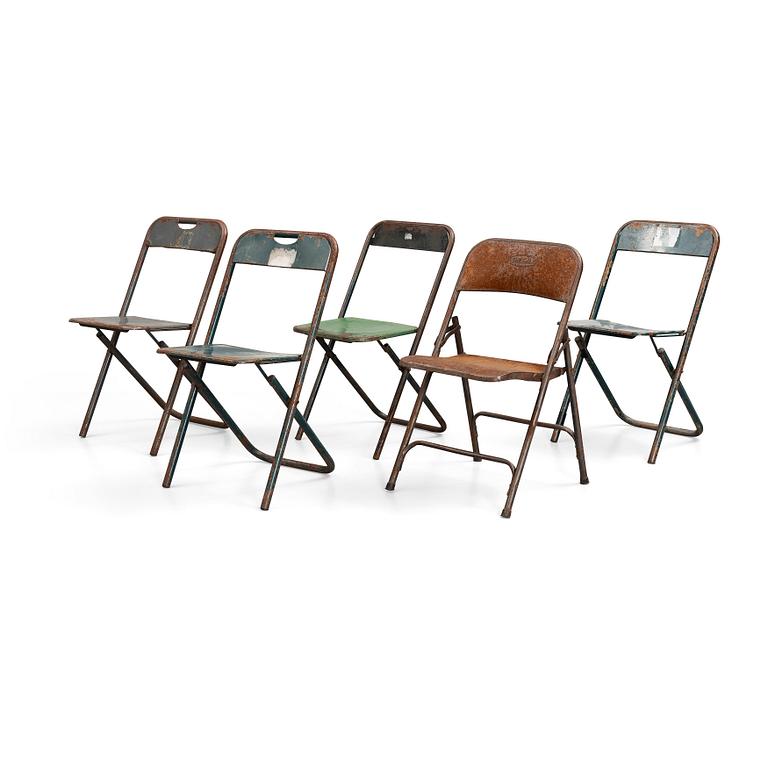 A set of five folding chairs.