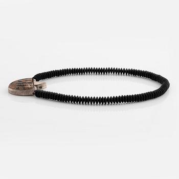 Gaudy necklace, silver and carved stone.