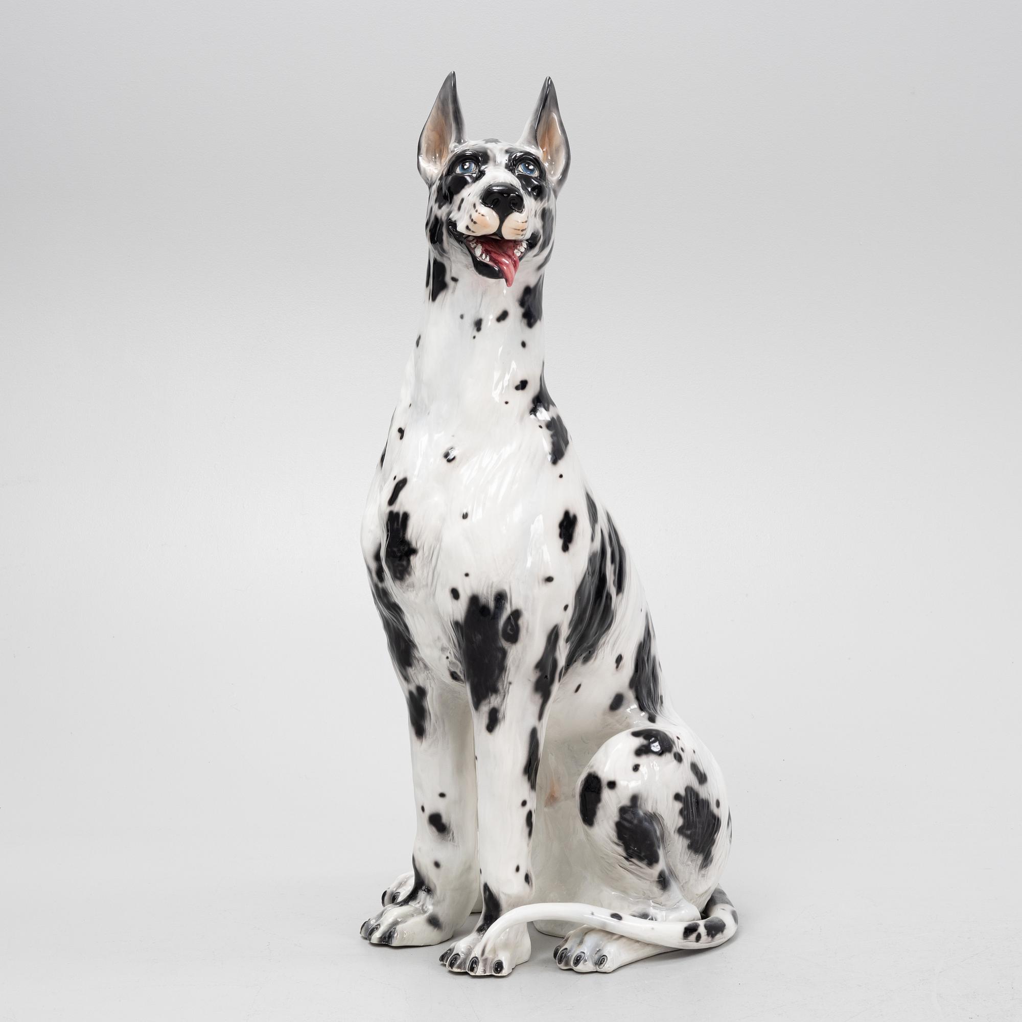 A ceramic decorative sculpture of a dog, late 20th Century.