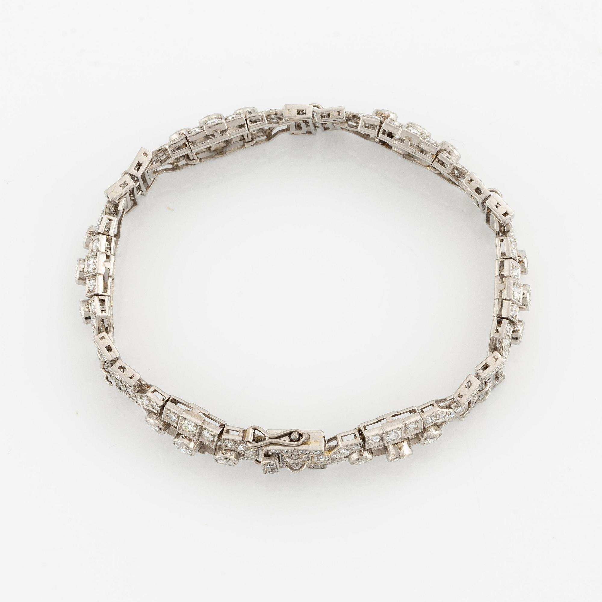 A platinum bracelet with round brilliant-and eight-cut diamonds.