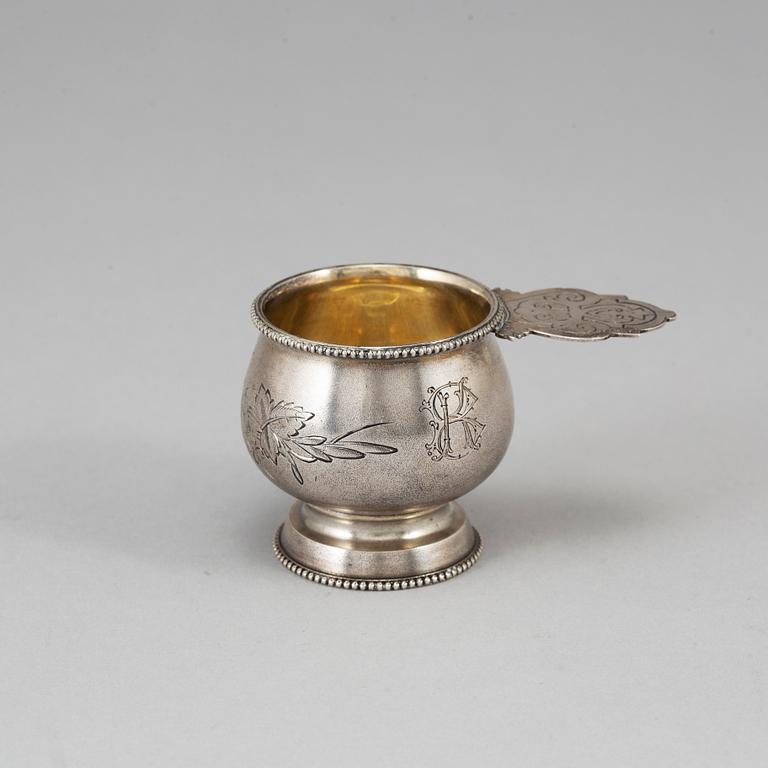 A Russian parcel-gilt silver vodka cup, Moscow 1888.