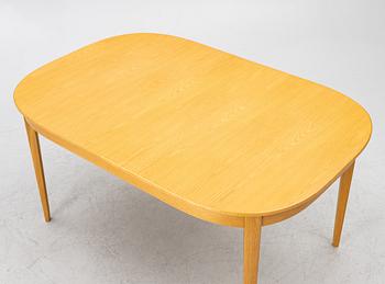 Carl Malmsten, a dining table with eight chairs, 'Camlare Nyckel', Sweden, second half of the 20th century.