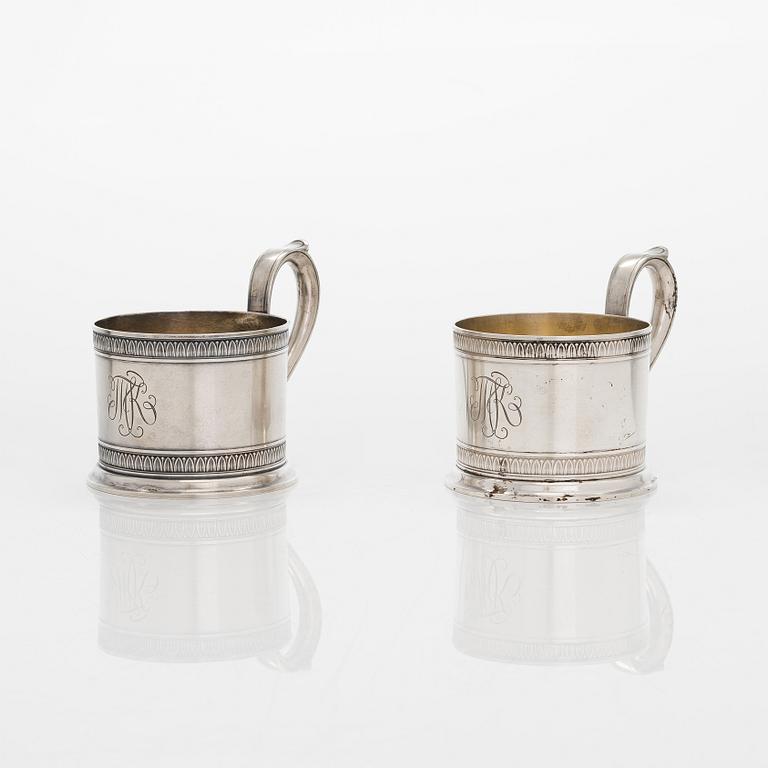 K. Fabergé, a pair of parcel-gilt silver teaglass holders, Imperial Warrant mark, Moscow 1908-17.