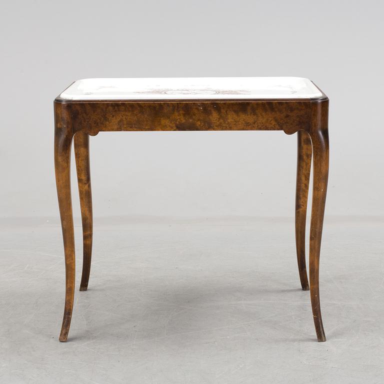 A porcelain traytop table by Nordiska Kompaniet and presumably Rörstrand.