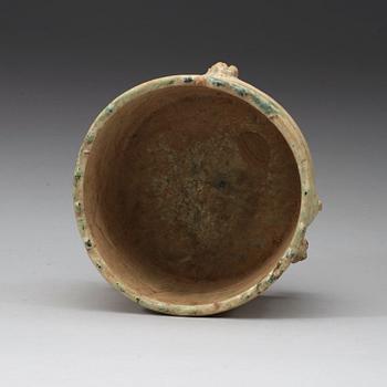 A green glazed tripod censer, Han dynasty (206 BC - 220 AD).