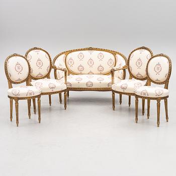 A Gustavian style sofa with two armchairs and two chairs, 20th century.