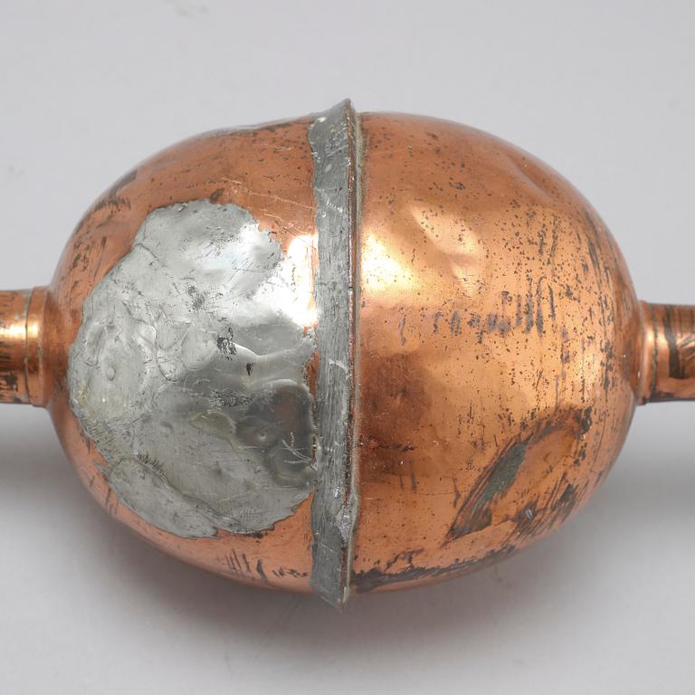 A 19th century pipette in copper.