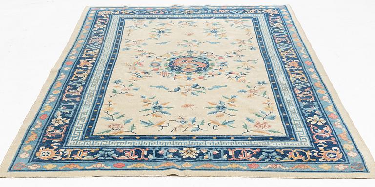 An antique/semi antique Chinese rug, 1920's/30's, c. 260 x 180 cm.