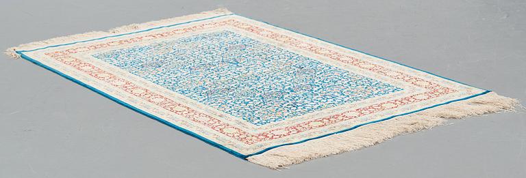 A RUG, old silk Hereke, ca 143,5 x 102,5 cm (+ the ends have 1,5 cm flat weave on each side).