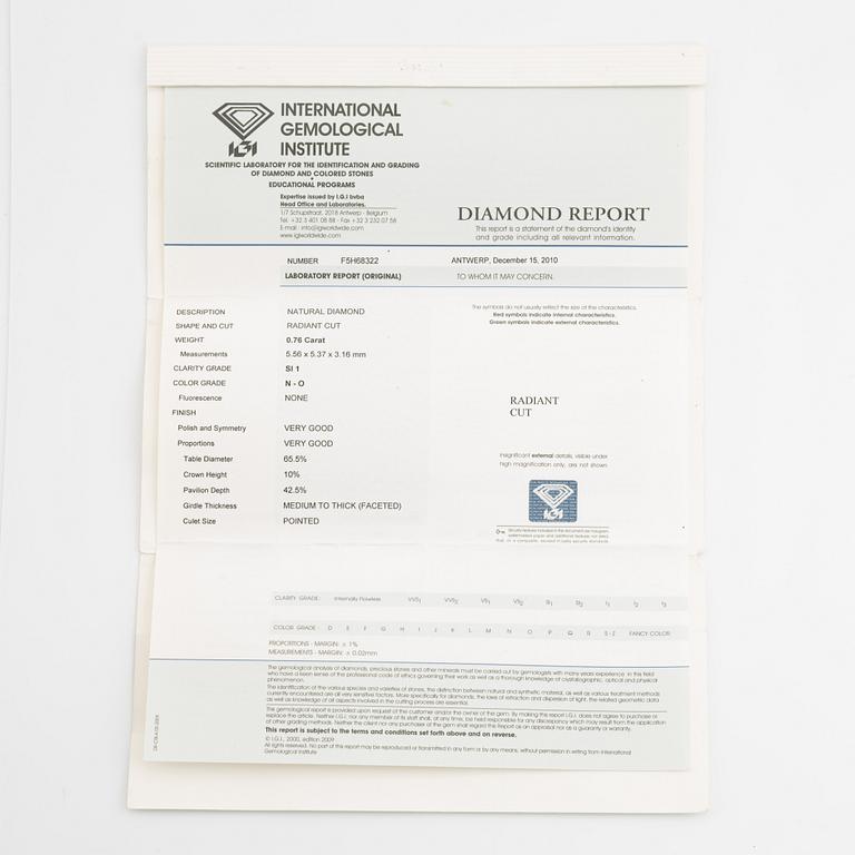 An 18K gold ring set with a radiant-cut diamond.