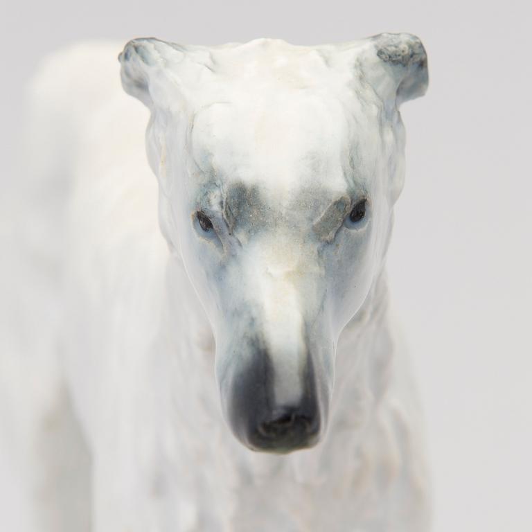 A porcelain borzoi figurine from Arabia Finland, signed and dated -30.