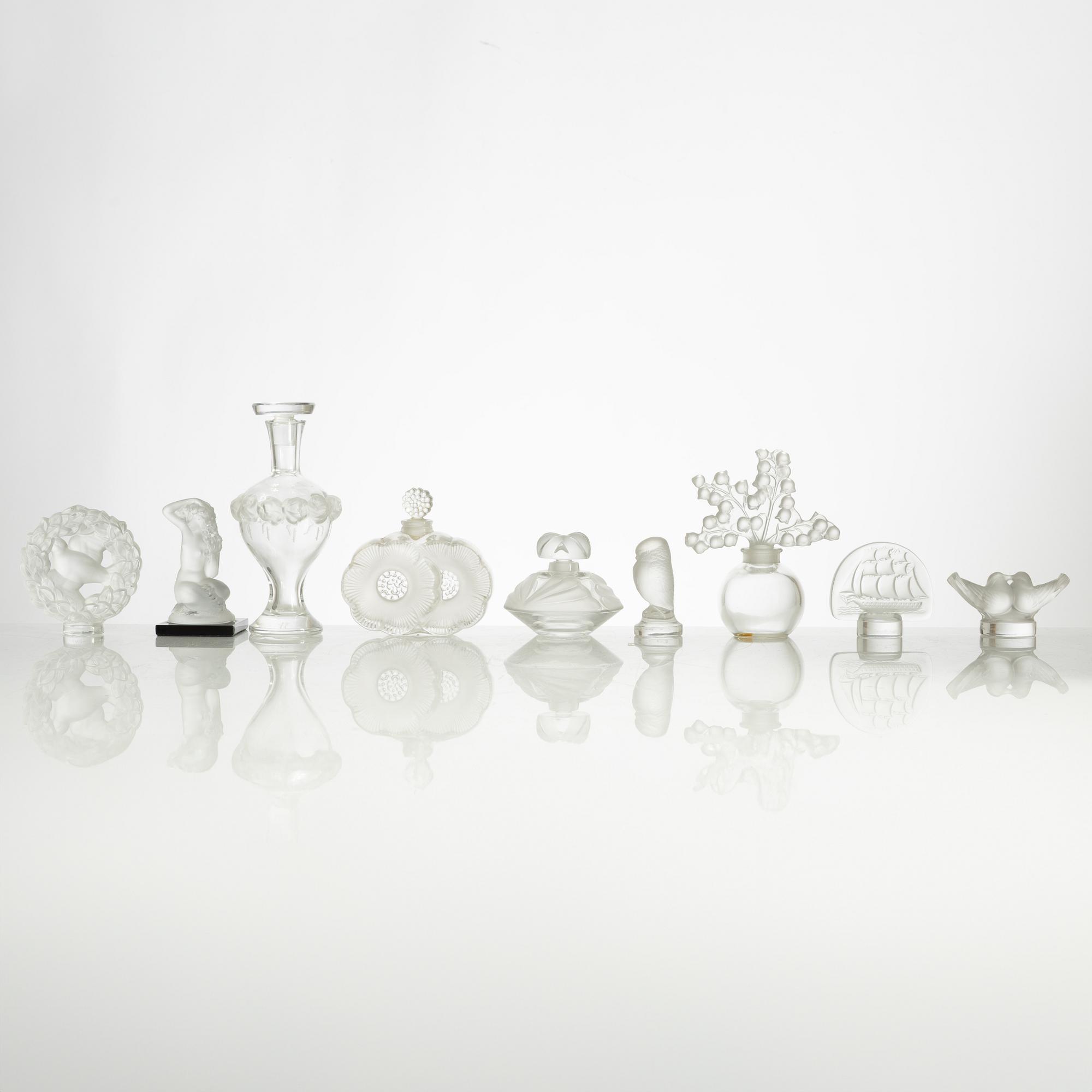 Lalique, four perfume bottles and five figurines, France, after 1945.