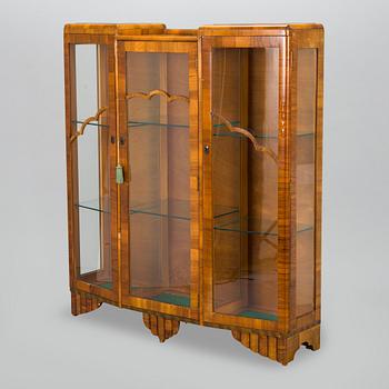 A 1940s display cabinet, England.