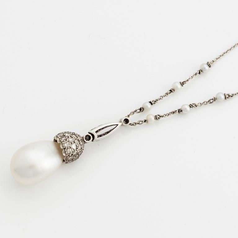 Platinum necklace with drop-shaped cultured pearl, seed pearls, and diamonds.