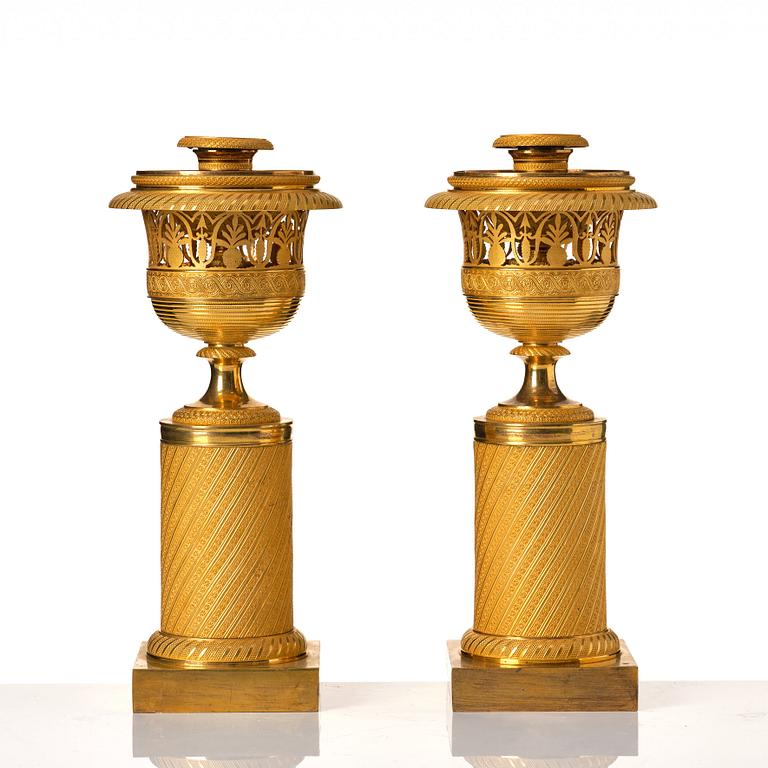 A pair of French Empire candlesticks, early 19th century.