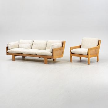 A oak sofa and easy chair, 1960s/70s.