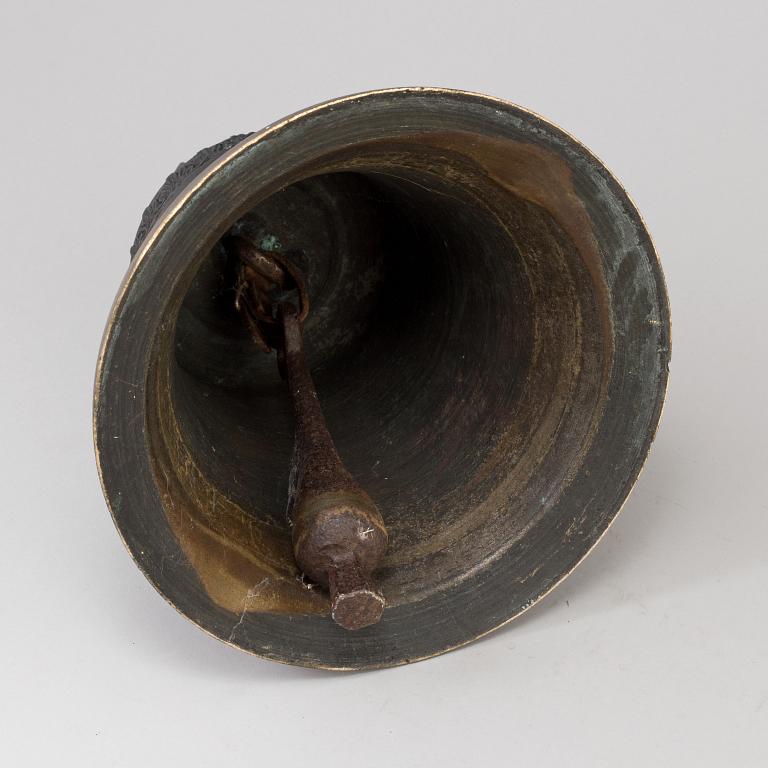 A BRONZE AND IRON BELL, dated 1759.