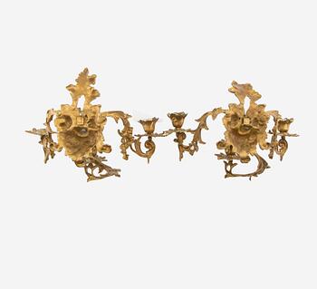 A pair of Louis XV style appliqués, late 19th century.