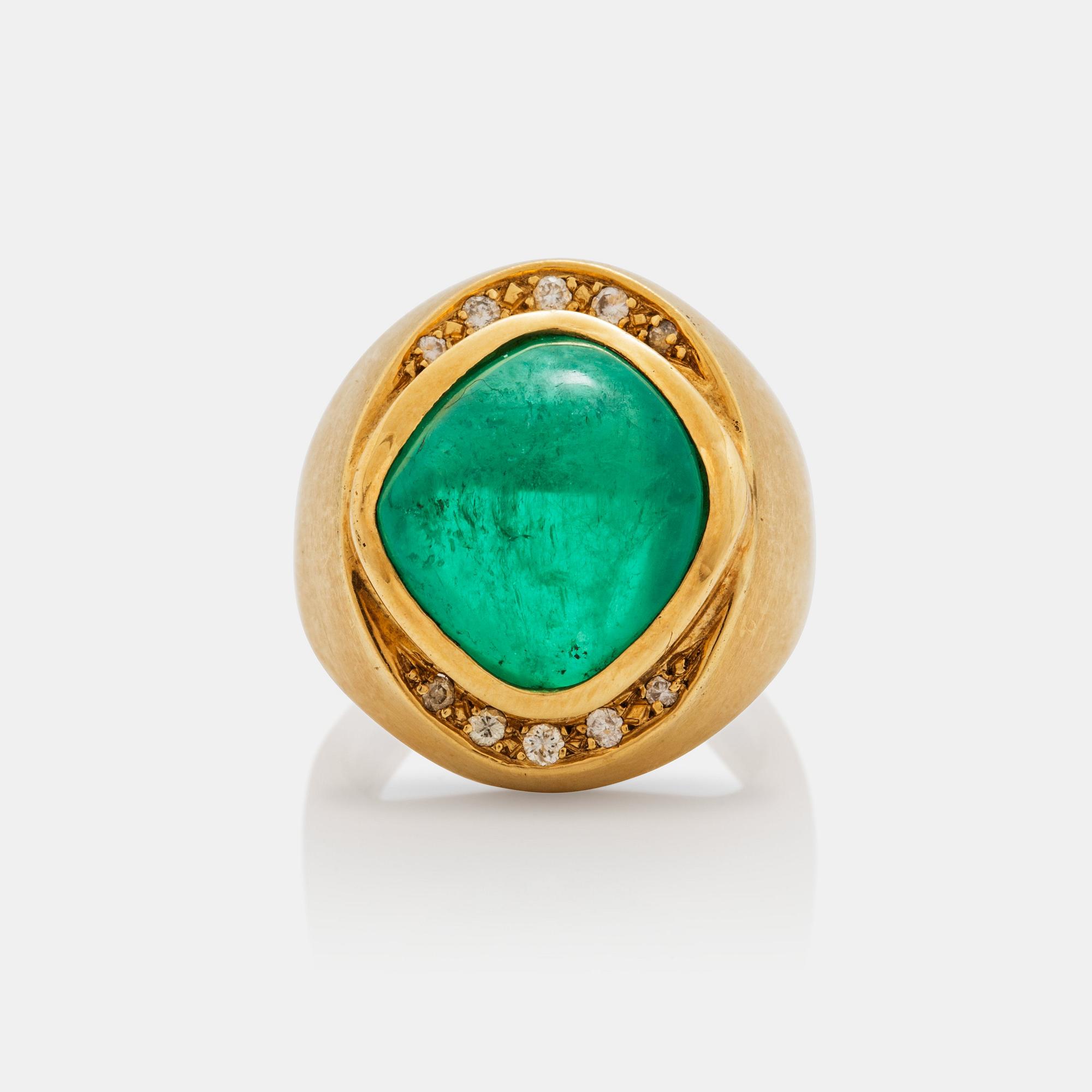 A circa 12.00 ct cabochon cut emerald and brilliant cut diamonds signed Cartier.