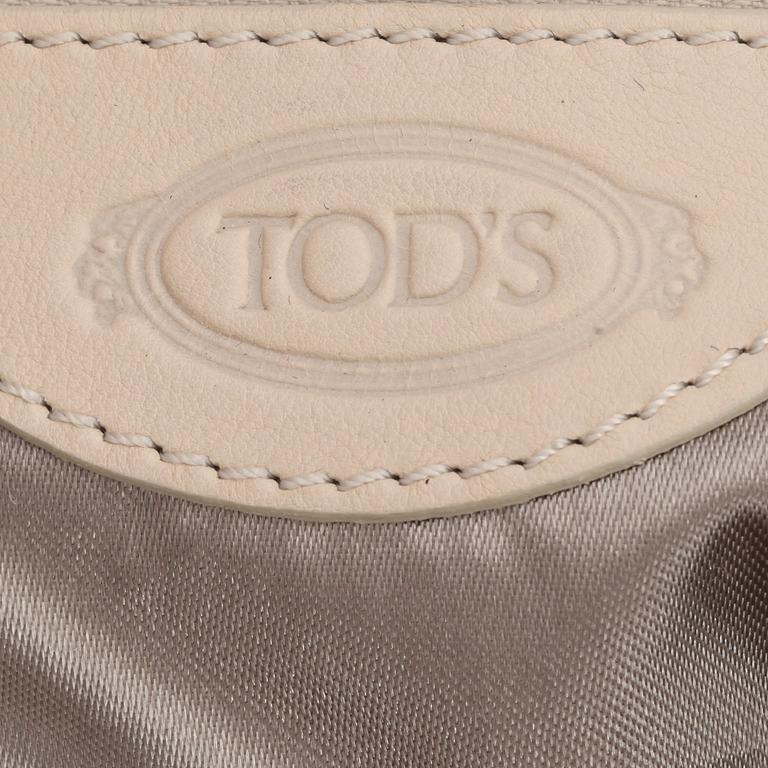 TOD'S. a light beige leather handbag.