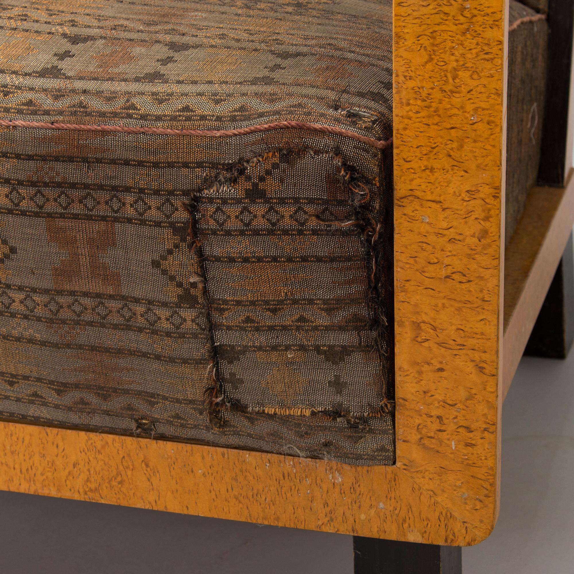 A  1920s Carelian birch veneered sofa.