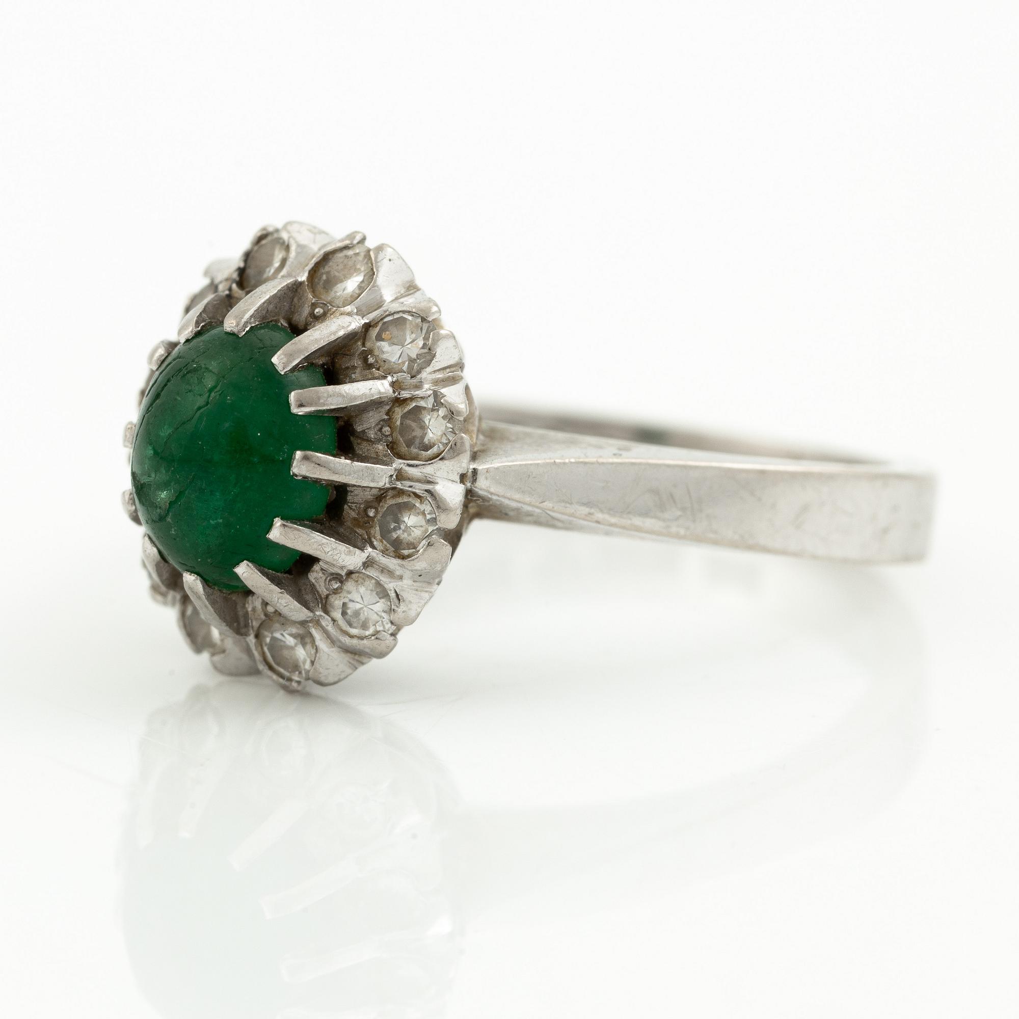 Ring, 18K white gold with cabochon-cut emerald and brilliant-cut diamonds.