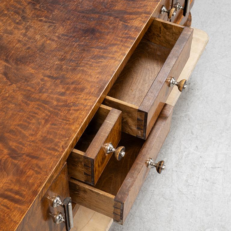 A chest of drawers with mirror, 1930's.