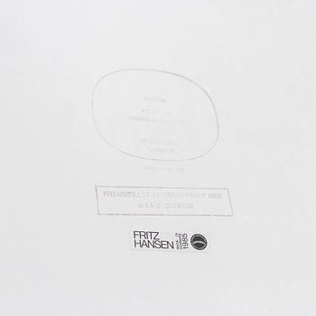 A 'Supercircular' table by Bruno Mathsson & Piet Hein for Fritz Hansen, dated 1985.