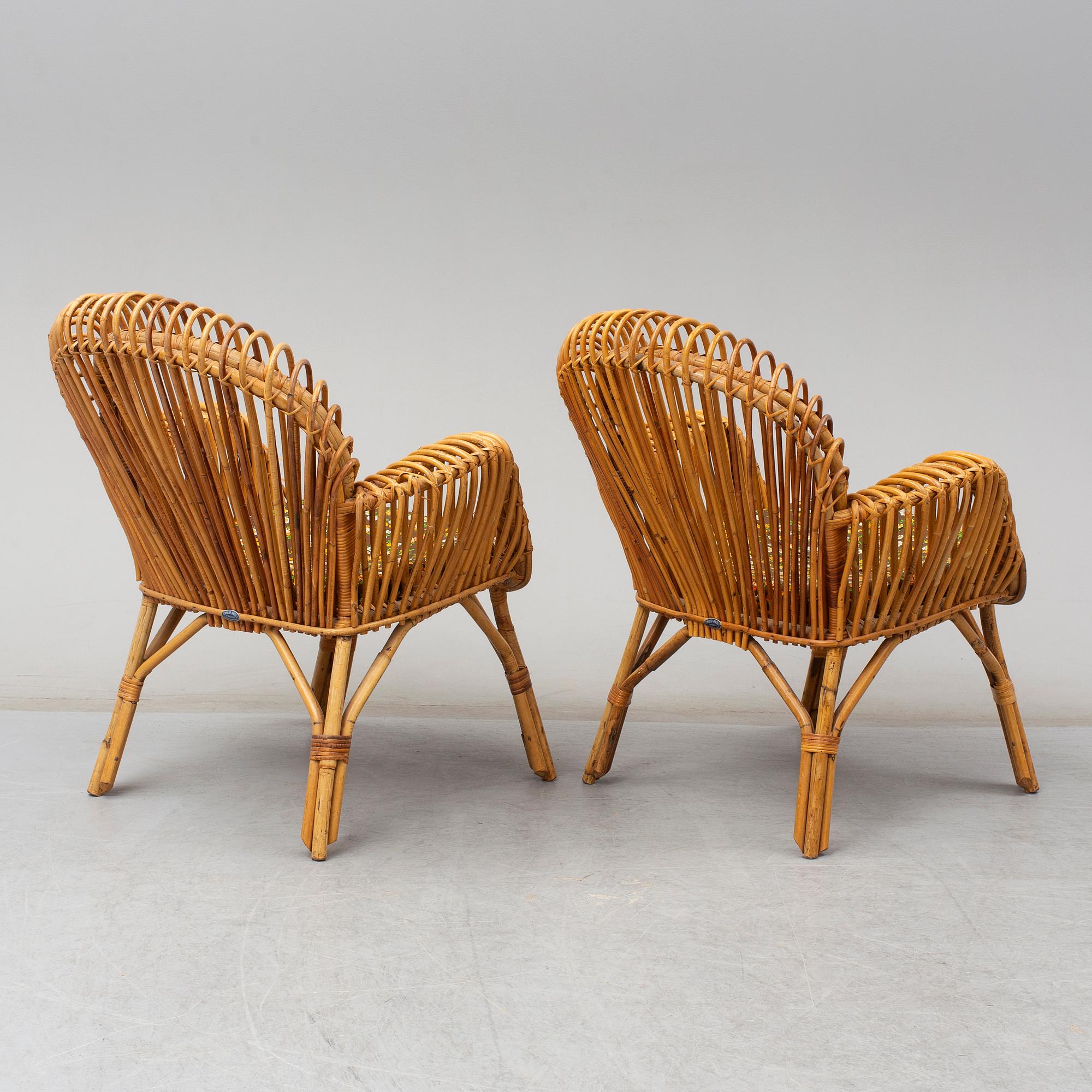 A pair of rattan armchairs, Emilio Paoli, via Vigna Nuova, 8, Firenze, Italy, second half of the 20th century. Signed.