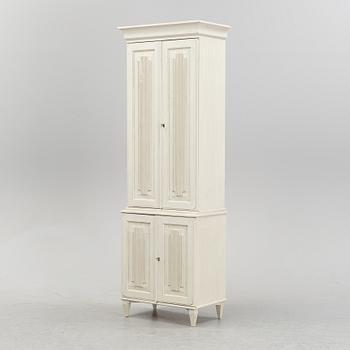 A contemporary Gustavian style cabinet.