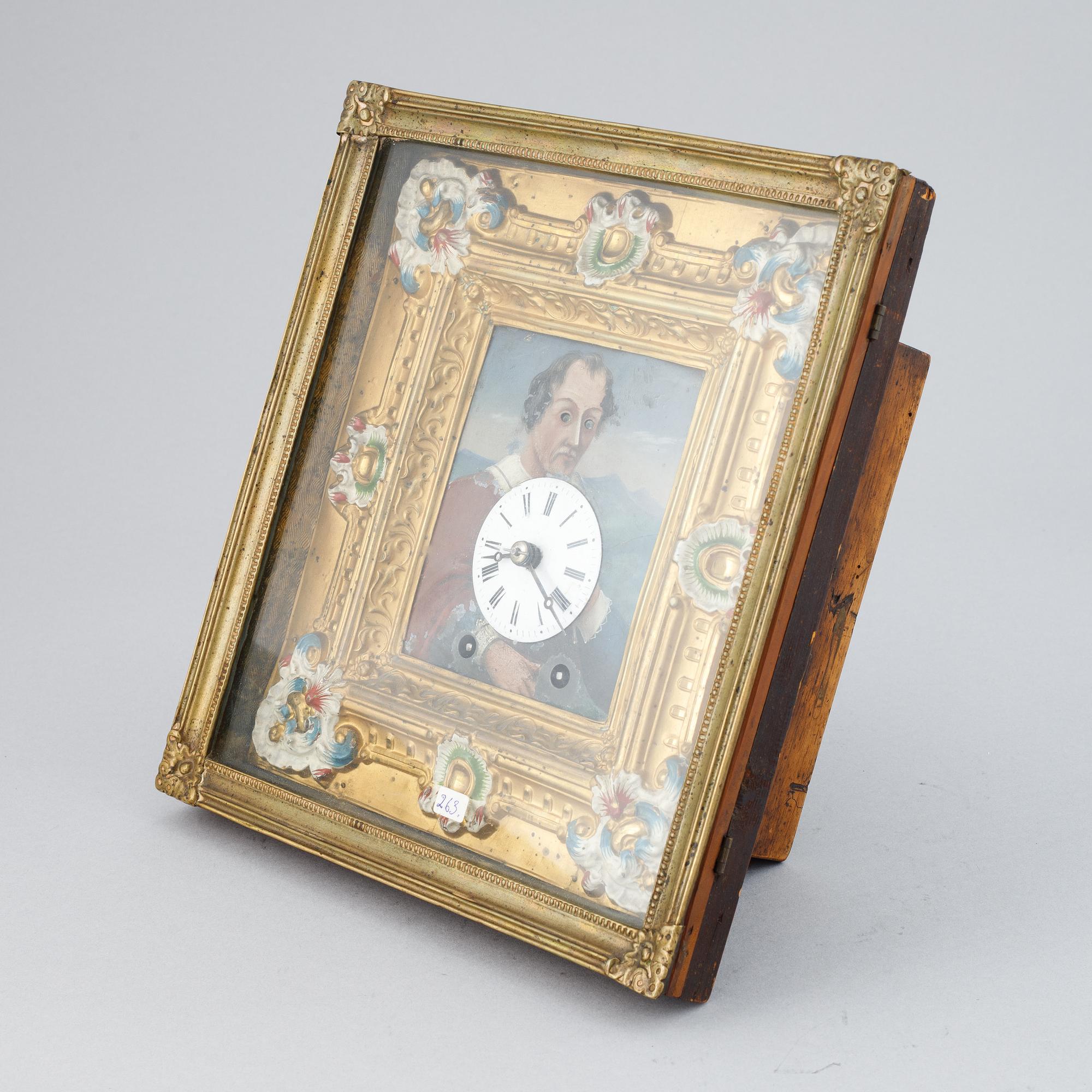 A Schwarzwald area wall pendulum clock with mechanical eye-movment, mid 19thcentury.