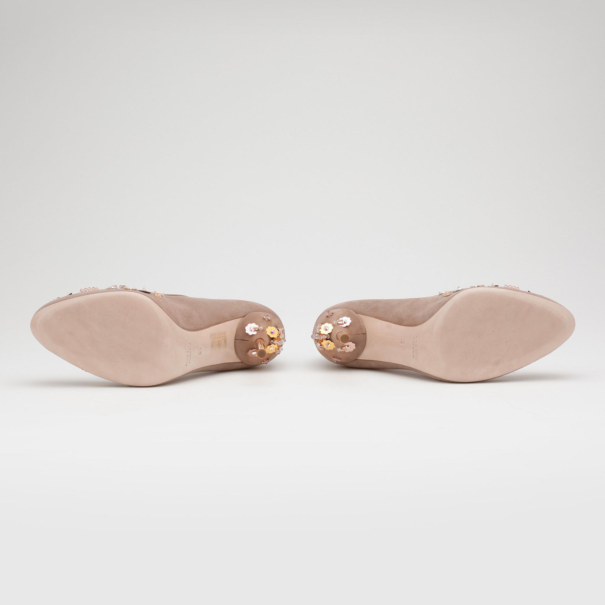 MIU MIU, a pair of beige suede pumps with sequined embellishment.