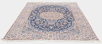 A carpet, Nain, part silk, ca. 295 x 201 cm.