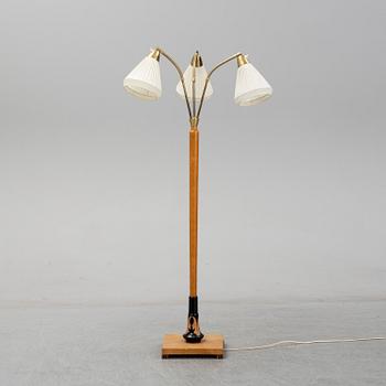 An elm floor light, mid 20th Century.