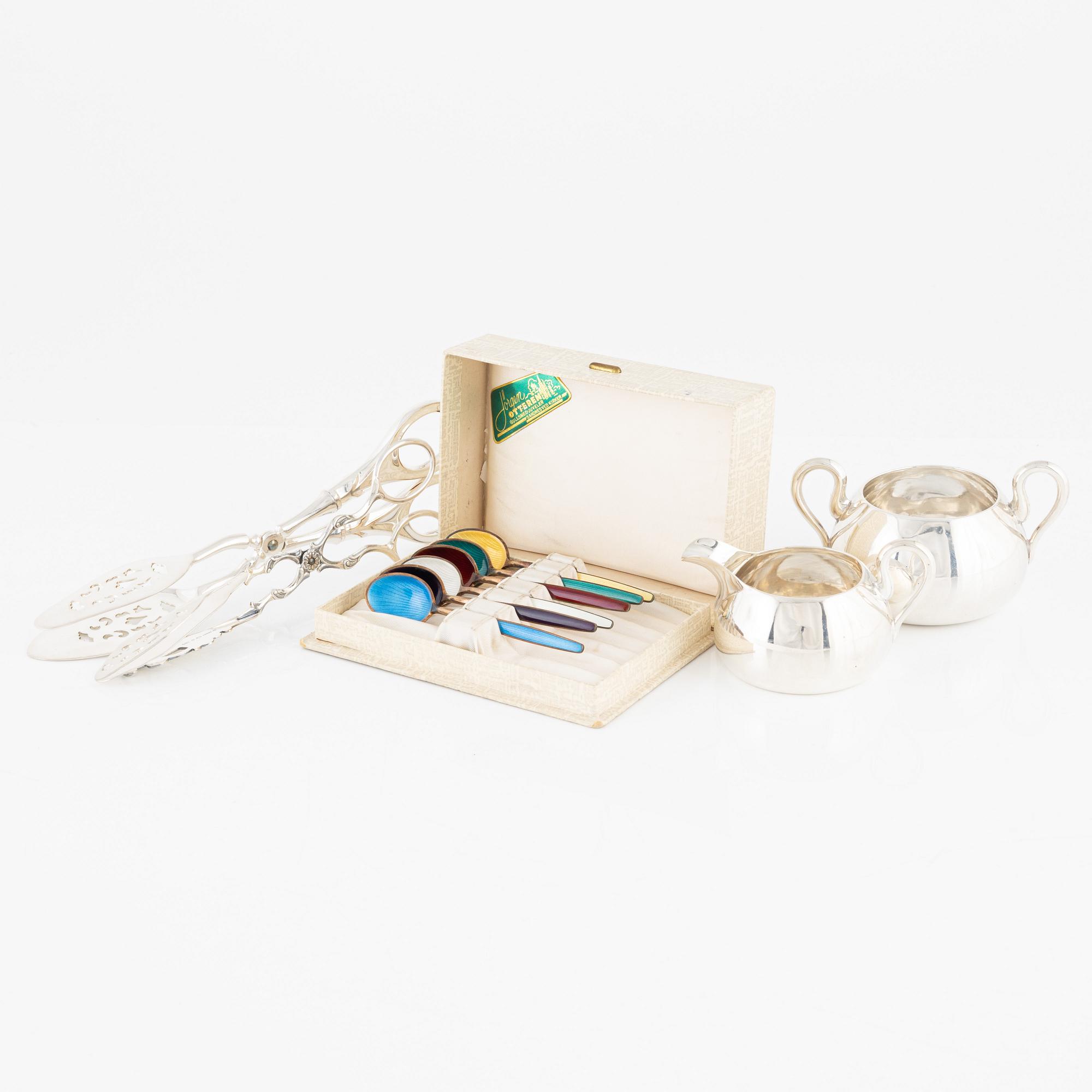 Enamel spoons, 6 pcs, sugar bowl and creamer, and two tongs, silver.