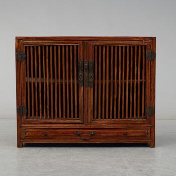 A stained second half of the 20th century cupboard from south-east Asia.