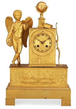 633. A French Empire early 19th century gilt bronze mantel clock.