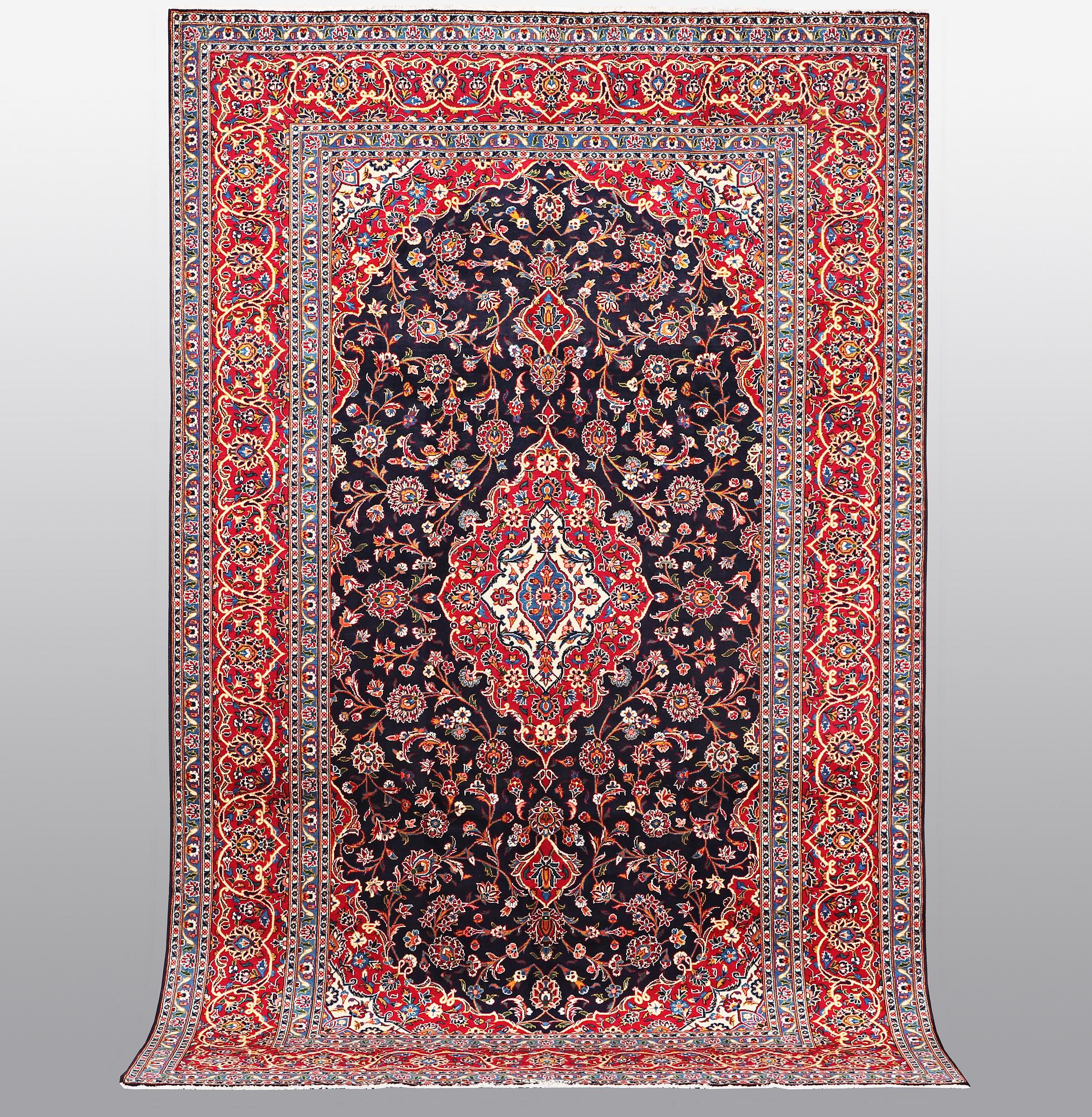 A carpet, Kashan signed Najafi, ca 360 x 231 cm.