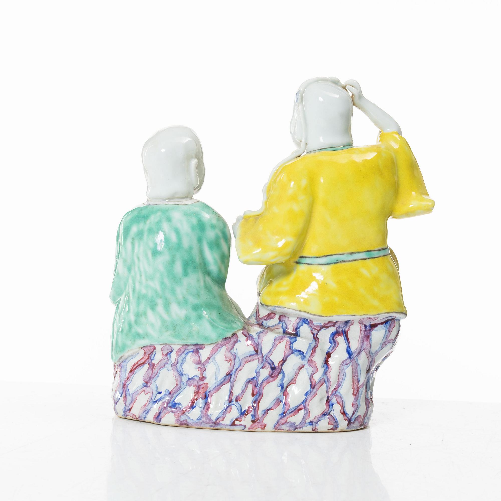 A Chinese porcelain figure group 'happy boys', Qing dynasty, 18th century.