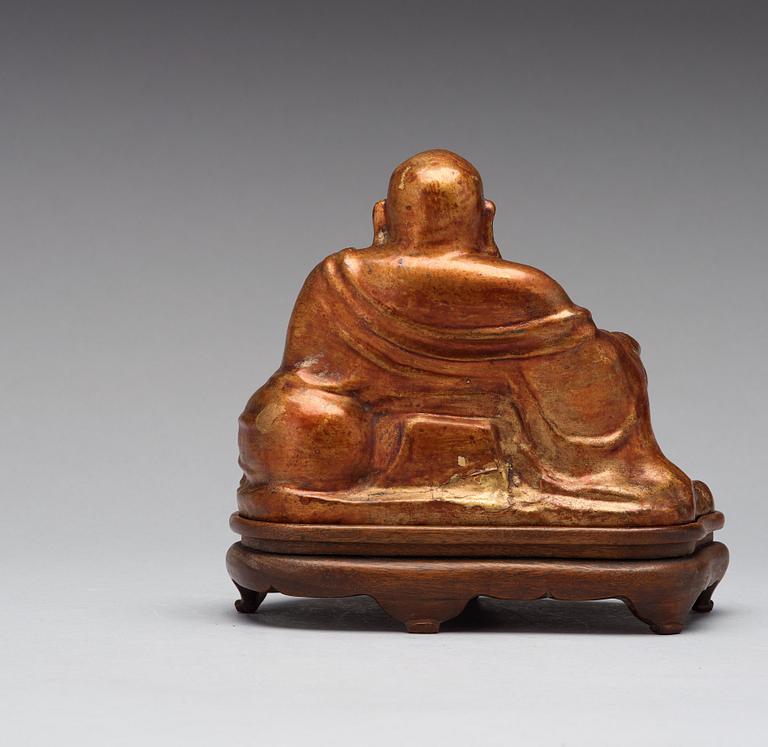 A seated figure of a bronze buddai, 17th/18th Century.