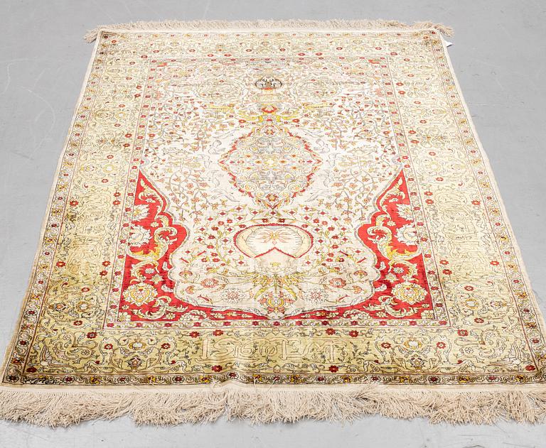 A rug, Old silk Hereke, ca 178 x 119 cm.