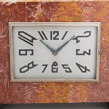 A signed S. Milan, French Art Deco 3 piece mantle clock by Marti dating to the 1920'/30s.