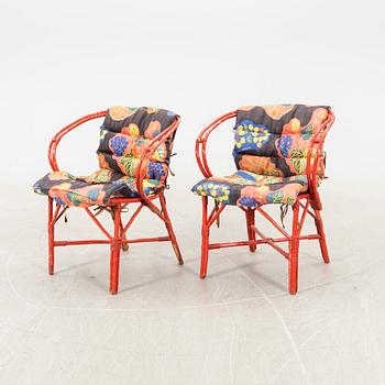 A pair of painted rattan armchairs possibly by Svenskt Tenn.