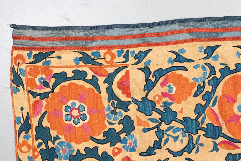 An embroidery, an antique suzani, ca 230 x 169 cm.