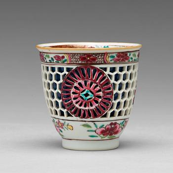 816. A famille rose and powder blue "devils work" cup, Qing dynasty, Qianlong (1736-95).